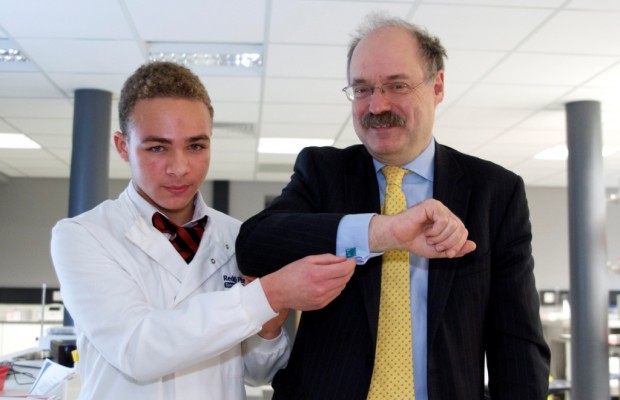 Sir Mark gets presented with cufflinks made by one of the students at the UTC.