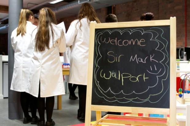 Chalk board saying 'Welcome Sir Mark Walport'