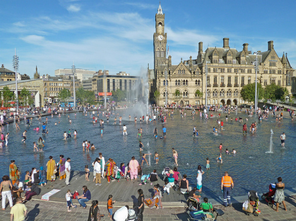 People in the fountain at Bradford City Park (Tim Green/CC BY 2.0)