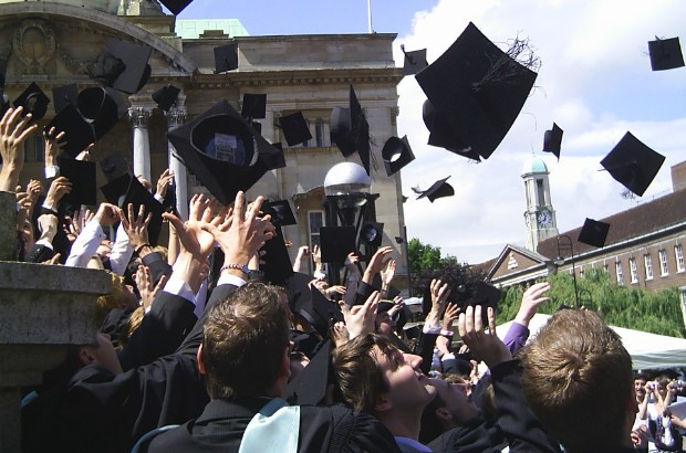 Graduates throwing their mortar boards in the air (credit: David Morris/CC BY-SA 2.0)